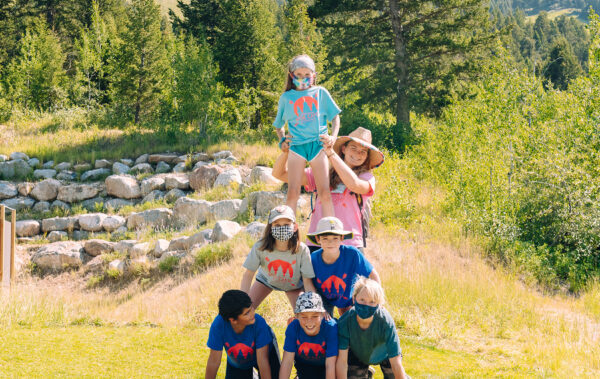 Kids forming human pyramid