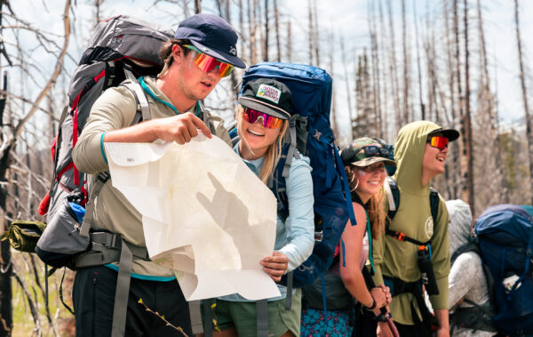 Backpackers looking at a map